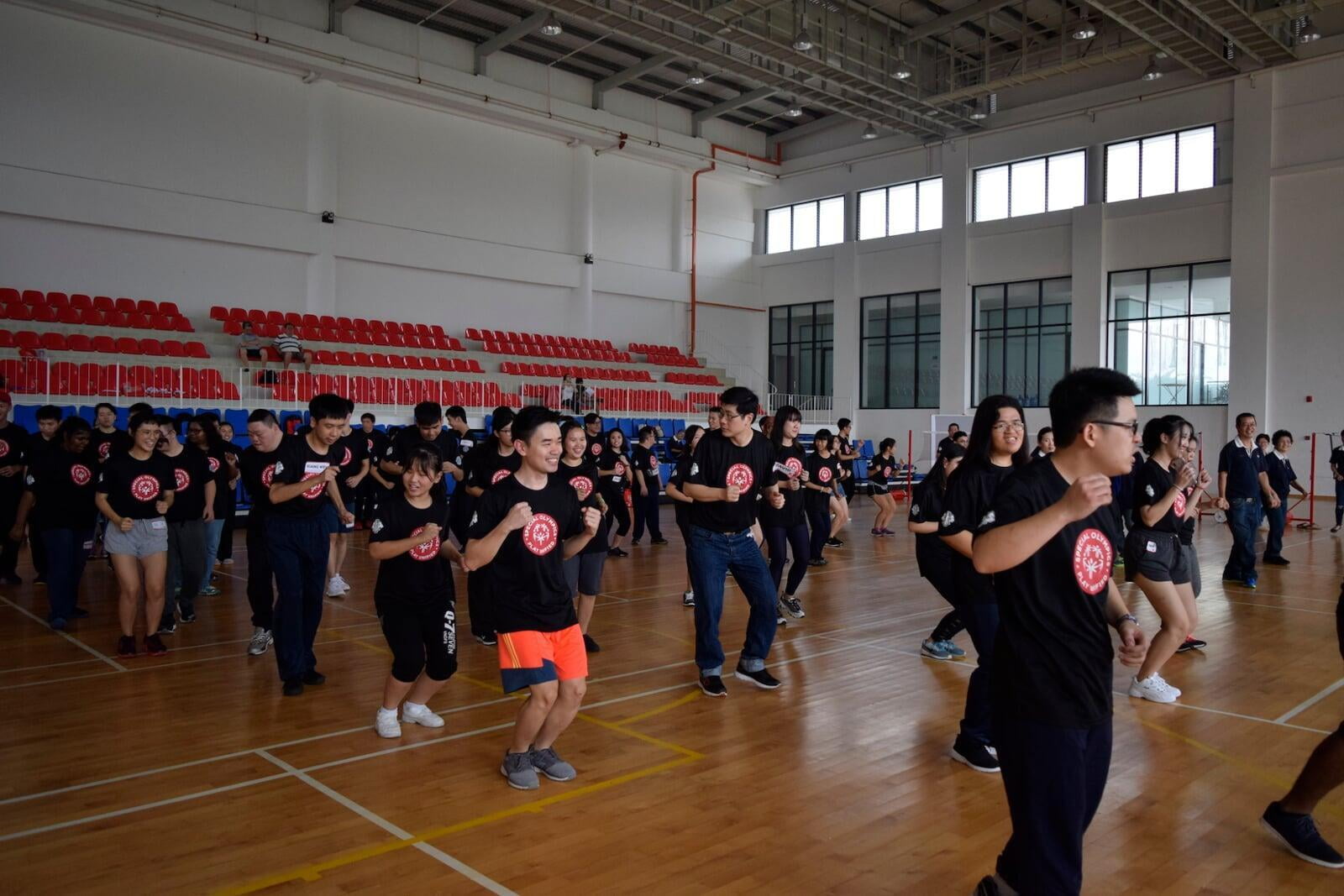 Special Olympics Malaysia Unified team doing warm up exercise